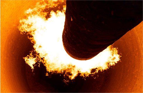 Fire coming out of an industrial furnace.