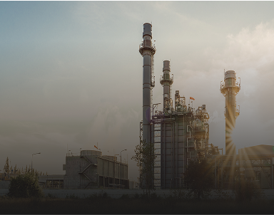 A manufacturing facility with tall smokestacks.
